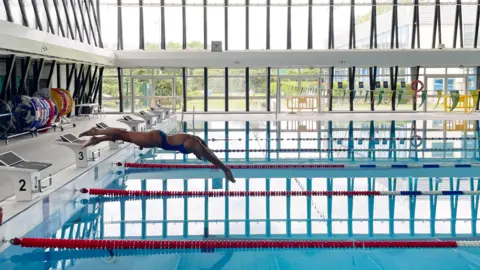 Valerie training at a Paris swimming pool