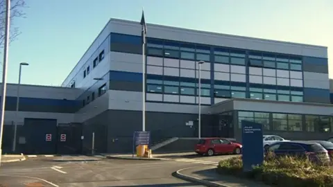 External view of Basingstoke police station with car park in front