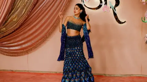 Reuters Indian actress Janhvi Kapoor poses on the red carpet during the sangeet ceremony of Anant Ambani and Radhika Merchant at Jio World Centre, Mumbai, India, July 5, 2024.