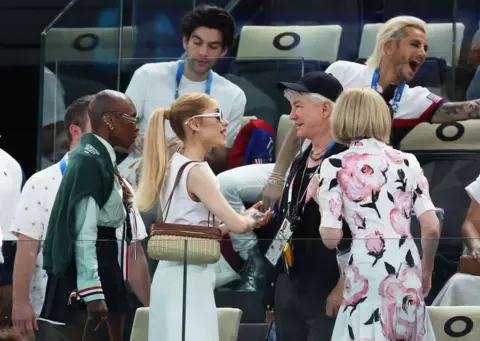 Getty Images  Cynthia Erivo, Ariana Grande, Anna Wintour and Baz Luhrmann interact upon attending the Artistic Gymnastics Women's Qualification on day two of the Olympic Games in Paris 