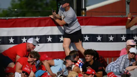 Getty Images People taking cover during the rally in Butler PA