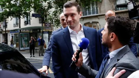 REUTERS/Benoit Tessier Jordan Bardella, President of the French far-right National Rally (Rassemblement National - RN) party, arrives at the RN party headquarters in Paris