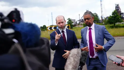 PA Media Jonathan Reynolds and Welsh first minister Vaughan Gething outisde Tata Steel