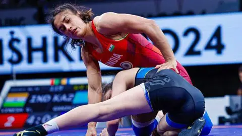 Getty Images Vinesh Vinesh of India wins against Laura Ganikyzy of Kazakhstan in the 50kg Women's wrestling 1/2 Final during the Seniors Asian OG Qualifier on April 20, 2024 in Bishkek, Kyrgyzstan.