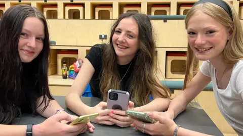 BBC Teenagers Courtney, Ffion and Grace on their mobile phones