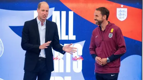 Reuters Prince William standing beside Gareth Southgate