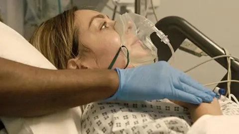 BBC | Wildflame Productions Amy Dowden in hospital on a respirator