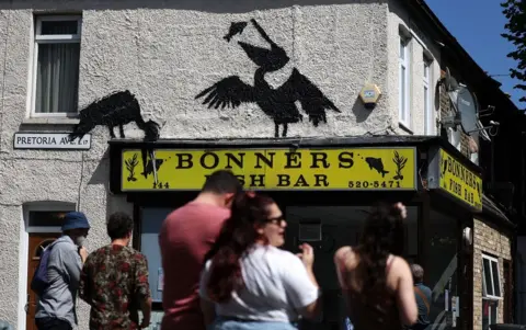  EPA-EFE/REX/Shutterstock Banksy's pelicans, above Bonners fish bar 