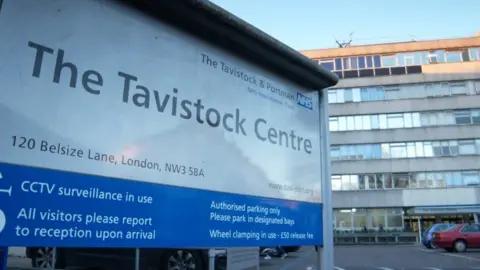 PA Media The sign outside the gender care clinic run by Tavistock and Portman NHS Trust in London