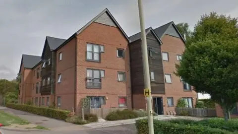 Google A brick block of flats taken from a Google maps screenshot