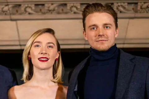 Getty Images Saoirse and Jack Louden wearing lovely clothes at a film premiere