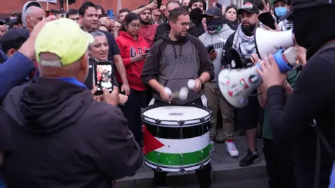 PA Media Demonstrators play drums at an anti-racism protest in Walthamstow