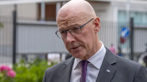 PA Media John Swinney