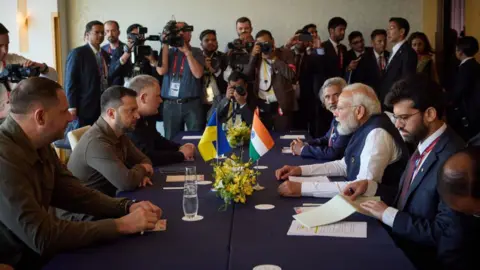 Getty Images HIROSHIMA, JAPAN - MAY 20: (----EDITORIAL USE ONLY - MANDATORY CREDIT - 'UKRAINIAN PRESIDENCY/ HANDOUT' - NO MARKETING NO ADVERTISING CAMPAIGNS - DISTRIBUTED AS A SERVICE TO CLIENTS----) Ukrainian President Vladimir Zelenskiy (L) meets with Indian Prime Minister Narendra Modi (R) as he attend G7 Leaders's Summit in Hiroshima, Japan on May 20, 2023. (Photo by Ukrainian Presidency/Handout/Anadolu Agency via Getty Images)