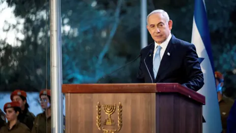 Reuters Israeli Prime Minister Benjamin Netanyahu speaks at a state memorial ceremony for Zeev Jabotinsky at Mount Herzl military cemetery in Jerusalem (4 August 2024)