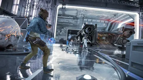 Ubisoft A screenshot from Star Wars Outlaws in which the character is shooting a gun, in what looks like a warehouse.