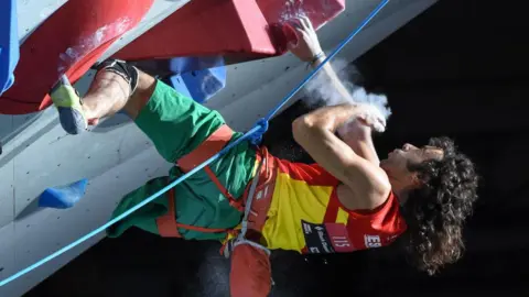 Getty Images A para-athlete scales a climbing wall