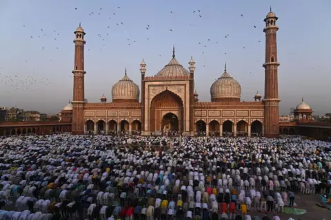 Getty Images Muslim devotees are offering Eid al-Adha prayers at Jama Masjid, in the old quarters of New Delhi, India, on June 17, 2024. (Photo by Kabir Jhangiani/NurPhoto via Getty Images)