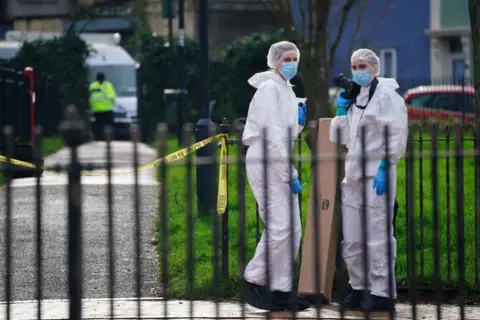 PA Media Forensic officers at the scene where Darrian Williams was stabbed in Bristol