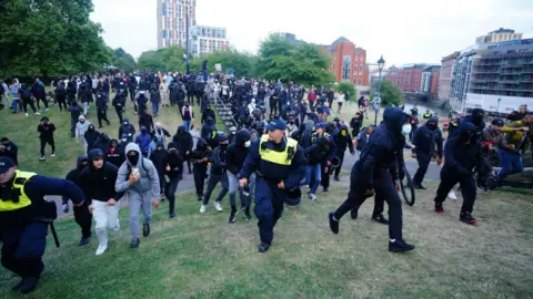 PA Media Anti-racism protesters demonstrate in Castle Park in Bristol