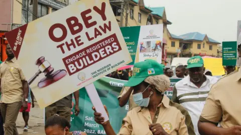 Getty Images The Nigerian Institute of Building in conjunction with Building Collapse Prevention Guild holds a walk against building collapse, with the theme Building with Integrity, as part of activities marking the 2022 Builders Day in Ikeja, Lagos, Nigeria, on Saturday, March 12, 2022