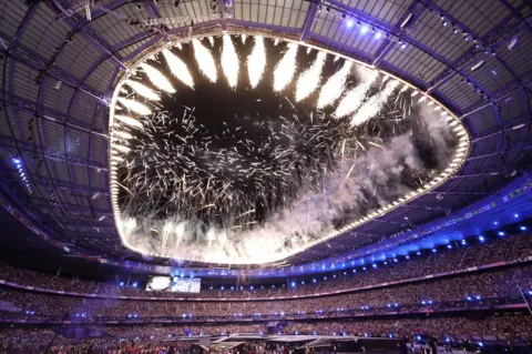 Christophe Petit-Tesson / EPA-EFE Fireworks at the Stade de France Stadium in Paris, France