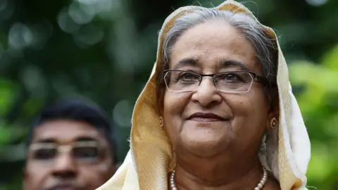 Getty Images  Bangladesh Prime Minister Sheikh Hasina tours the orchid garden after the orchid naming ceremony at the National Orchid Gardens on March 13, 2018 in Singapore. 