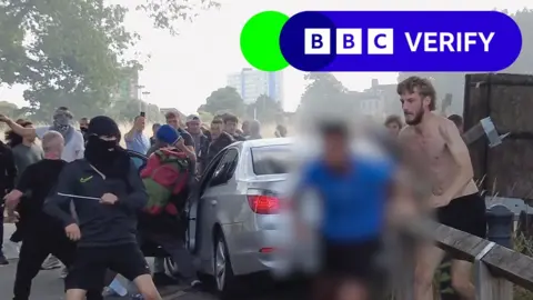 BBC Protestors attack a car in Hull