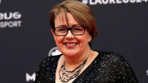 Getty Images Tanni Grey-Thompson smiles on a red carpet 