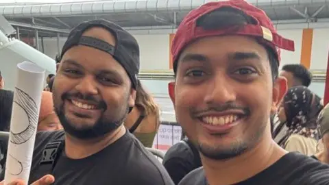 Dwayne Dias Dwayne Dias (left) and his friend pose for a photo at the concert venue in Singapore, where they had gone to watch Coldplay perform live