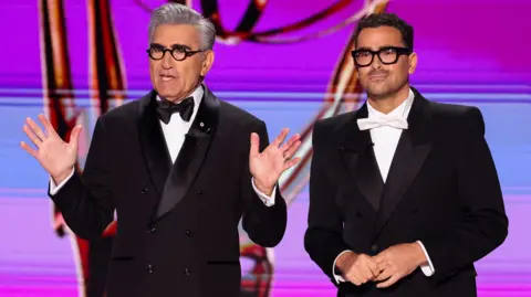 Reuters Eugene Levy and Dan Levy speak on stage at the 76th Primetime Emmy Awards in Los Angeles, California, U.S., September 15, 2024.