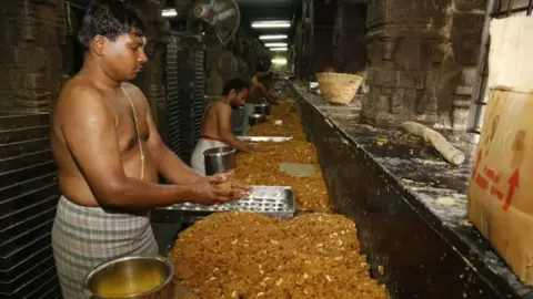 BBC Telugu Men making laddus in the Tirupati temple kitchen