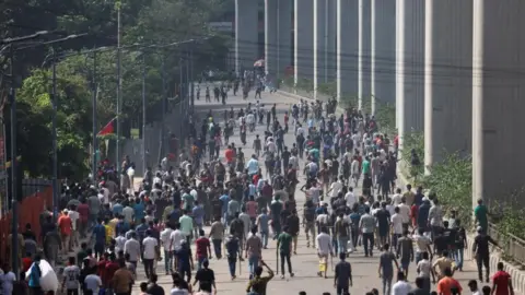 Reuters Protesters clash with police and the pro-government supporters, after anti-quota protester demanding the stepping down of the Bangladeshi Prime Minister Sheikh Hasina at the Bangla Motor area, in Dhaka, Bangladesh, August 4, 2024