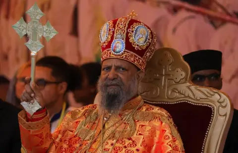 Tiksa Negeri / Reuters Abune Mathias, Patriarch of the Ethiopian Orthodox church, blesses the faithful during the Meskel festival, a celebration to commemorate the discovery of the True Cross on which Jesus Christ was crucified, in Addis Ababa, Ethiopia, September 26, 2024