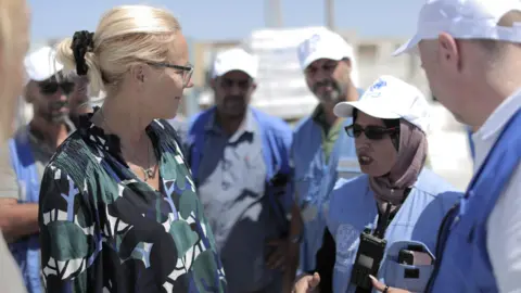 United Nations Ms Kaag speaks with an aid worker in Gaza