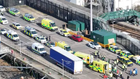 EDDIE MITCHELL Ambulances and police at Newhaven port on 16 February