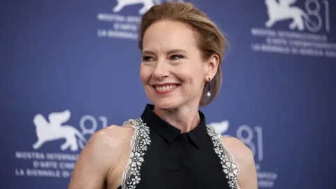 Reuters Cast member Amy Ryan poses during a photocall for the movie "The Wolfs" out of competition, at the 81st Venice Film Festival, Venice, Italy, September 1, 2024