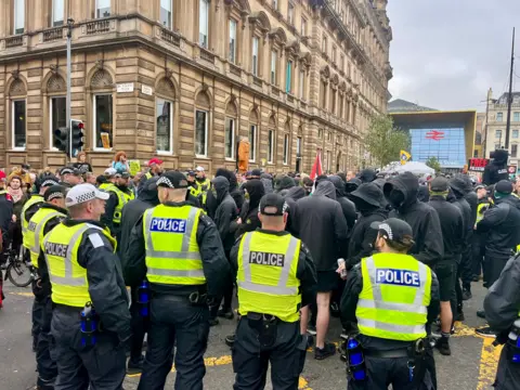 Members of the Green brigade surrounded by police