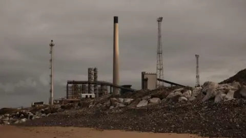 Mark Griffiths Conveyor belts and chimneys on the site are captured from nearby Aberafan beach