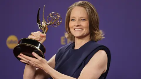 EPA Jodie Foster winner of the Outstanding Lead Actress in a Limited or Anthology Series or Movie for 'True Detective: Night Country' poses with her award in the press room during the 76th annual Emmy Awards ceremony held at the Peacock Theater in Los Angeles, California, USA, 15 September 2024