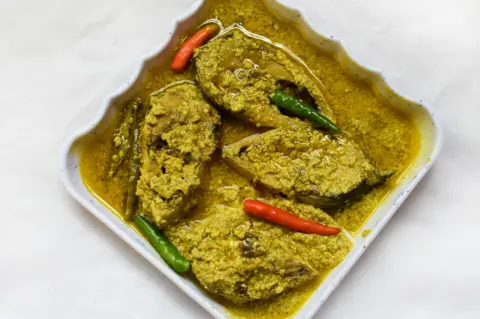 Getty Images Sorshe Illish or Hilsa fish curry with mustard seed is a famous Bengali dish.