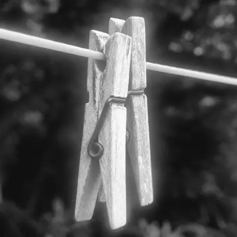 Miriam Simmons Two clothes pegs on a washing line 