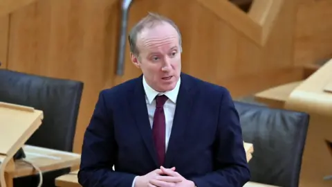 Getty Images Michael Marra speaking in Holyrood