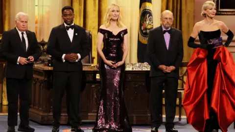 Getty Images Martin Sheen, Dulé Hill, Janel Moloney, Richard Schiff and Allison Janney speak onstage during the 76th Primetime Emmy Awards at Peacock Theater on September 15, 2024 in Los Angeles, California