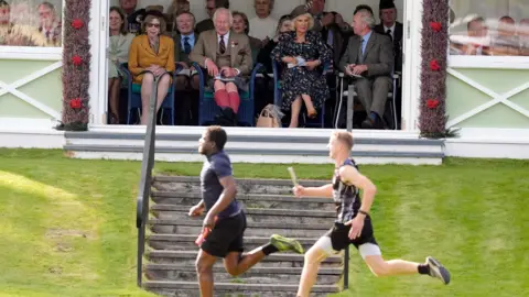 PA Media King Charles and Queen Camilla watching the games