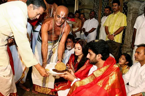 Getty Images The Tirupati temple is regularly visited by celebrities - this photos shows Bollywood stars Aishwarya Rai and Abhishek Bachchan at the temple three days after their wedding in 2007. Also seen are Amitabh Bachchan and industrialist Anil Ambani