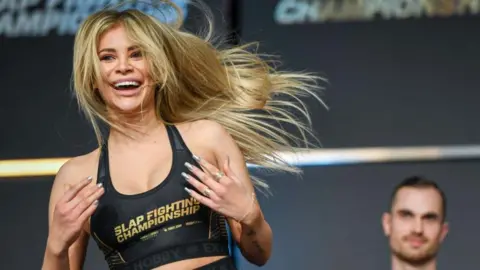 Getty Images/Gaelen Morse Adrianna “Flychanelle” Śledź smiles as she celebrates during a slap-fighting competition in Ohio