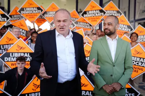 PA Ed Davey and Josh Babarinde on the campaign trail during the general election campaign in 2024