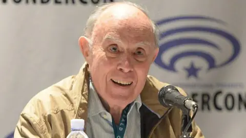 Getty Images David Graham in a cream jacket at WonderCon in 2016 in Los Angeles, California