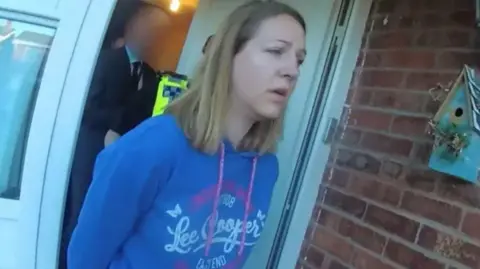 Cheshire Constabulary Lucy Letby leaving her home in handcuffs after her arrest 